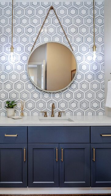 Bathroom vanity with blue geometric wallpaper