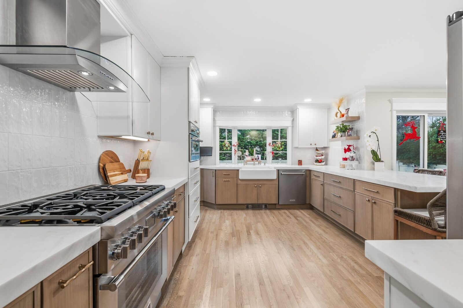 Renovated kitchen with custom cabinetry, view 006