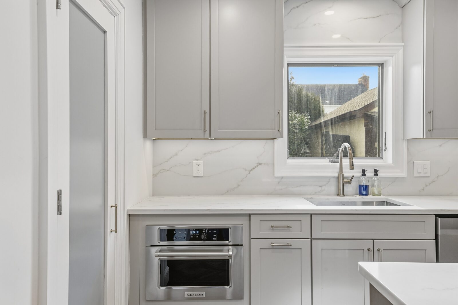 Renovated kitchen with custom cabinetry, view 045